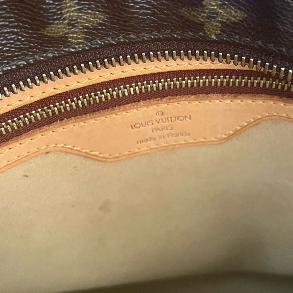 Authentic Louis Vuitton tote. Small red stain inside , great condition.